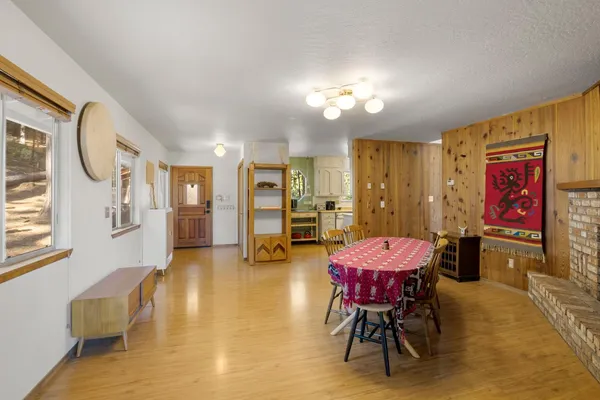 a living room with furniture and kitchen view