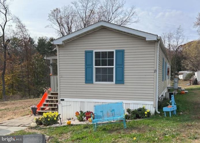 13 Springway Conowingo, MD 21918 - Photo 1 of 22 a front view of house with yard and green space