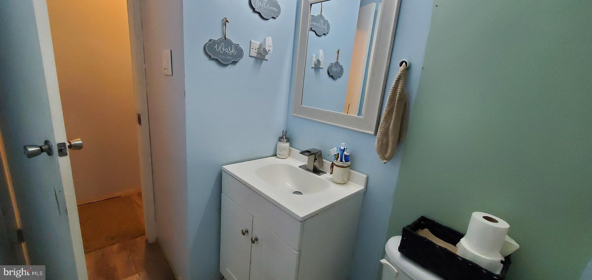 13 Springway Conowingo, MD 21918 - Photo 12 of 22 a bathroom with a sink mirror and vanity