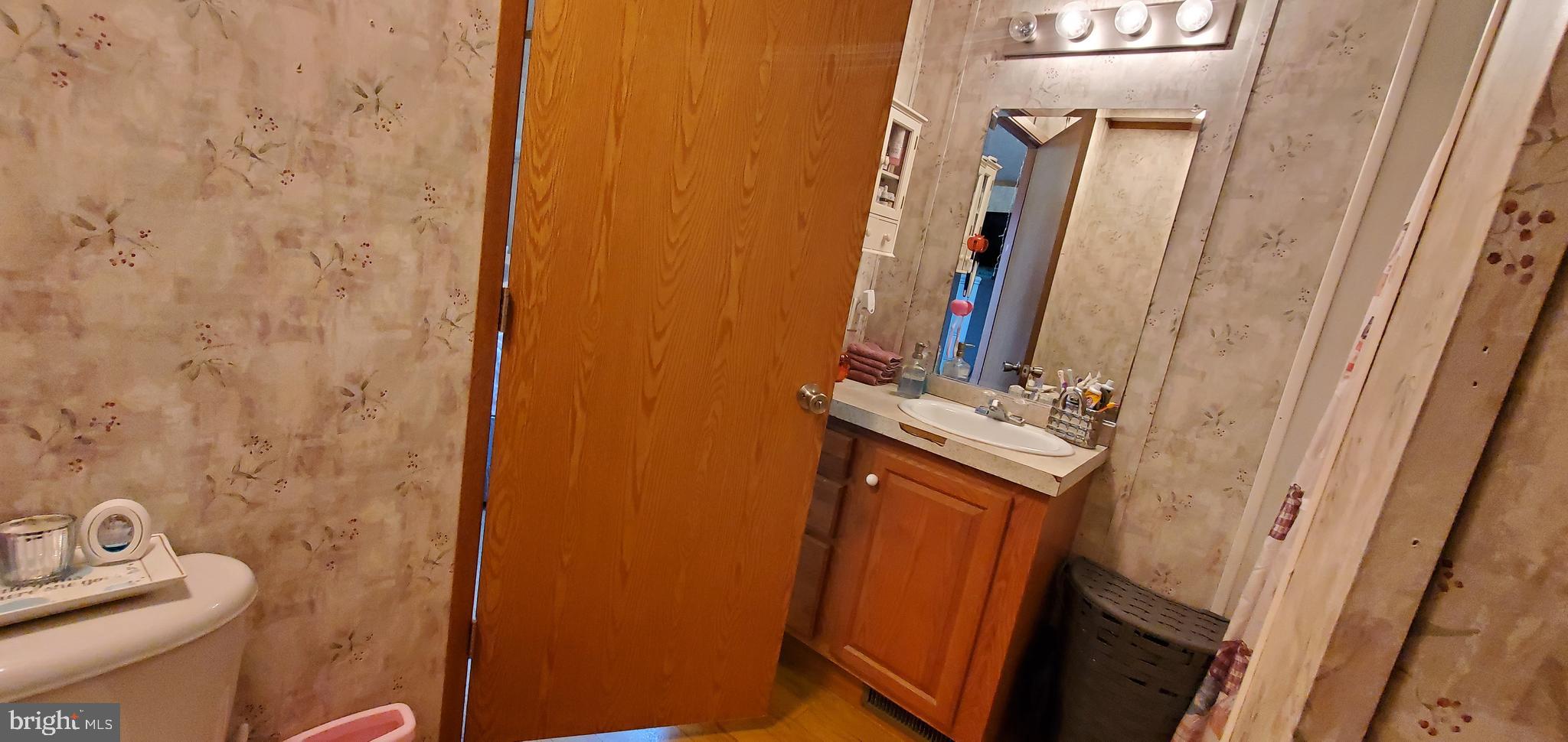 13 Springway Conowingo, MD 21918 - Photo 19 of 22 a bathroom with a sink and a mirror