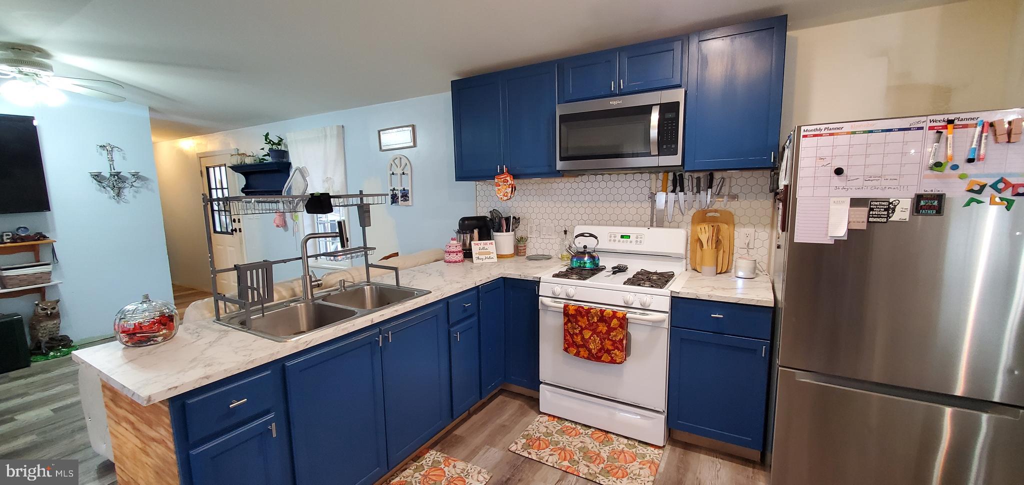 13 Springway Conowingo, MD 21918 - Photo 6 of 22 a kitchen with stainless steel appliances granite countertop a refrigerator a stove a sink and a microwave