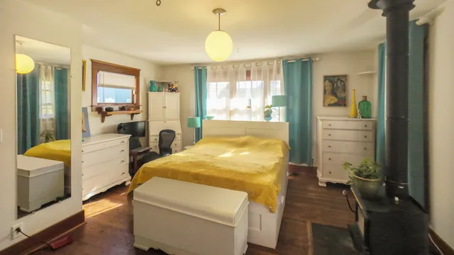 a bed room with a bed and a chandelier