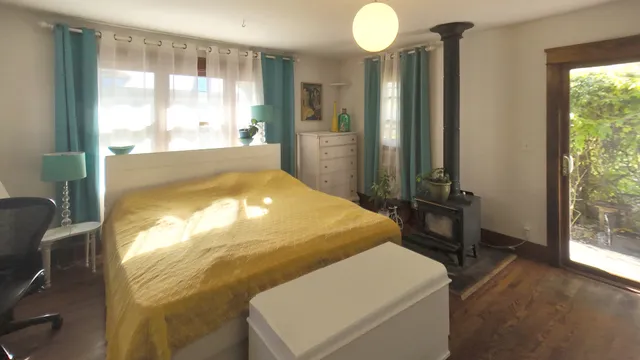 a room with pool table and windows