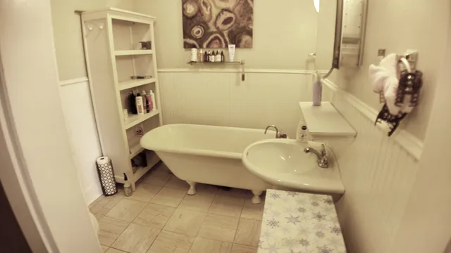a bathroom with a sink and mirror
