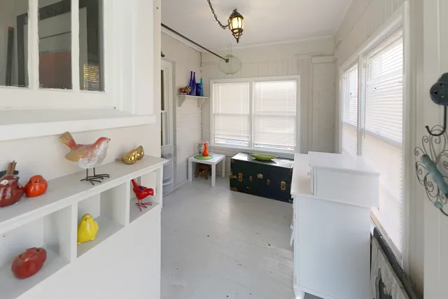 a kitchen with a refrigerator and window