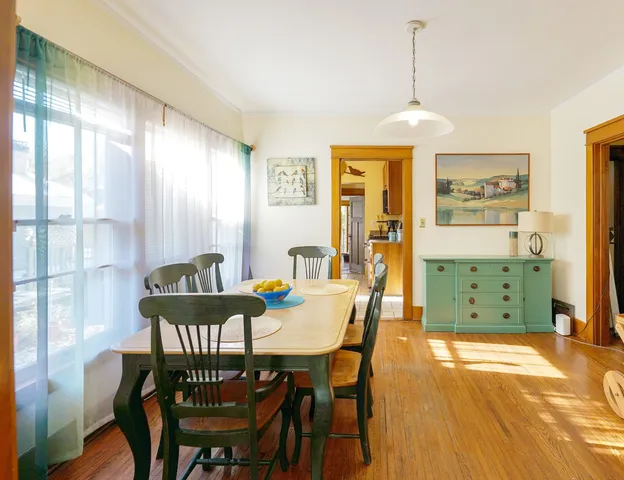 a view of a dining room with furniture window and outside view