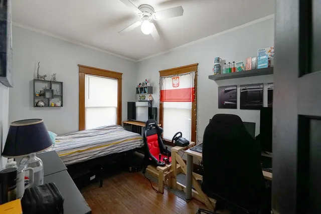 a bedroom with bed and a window