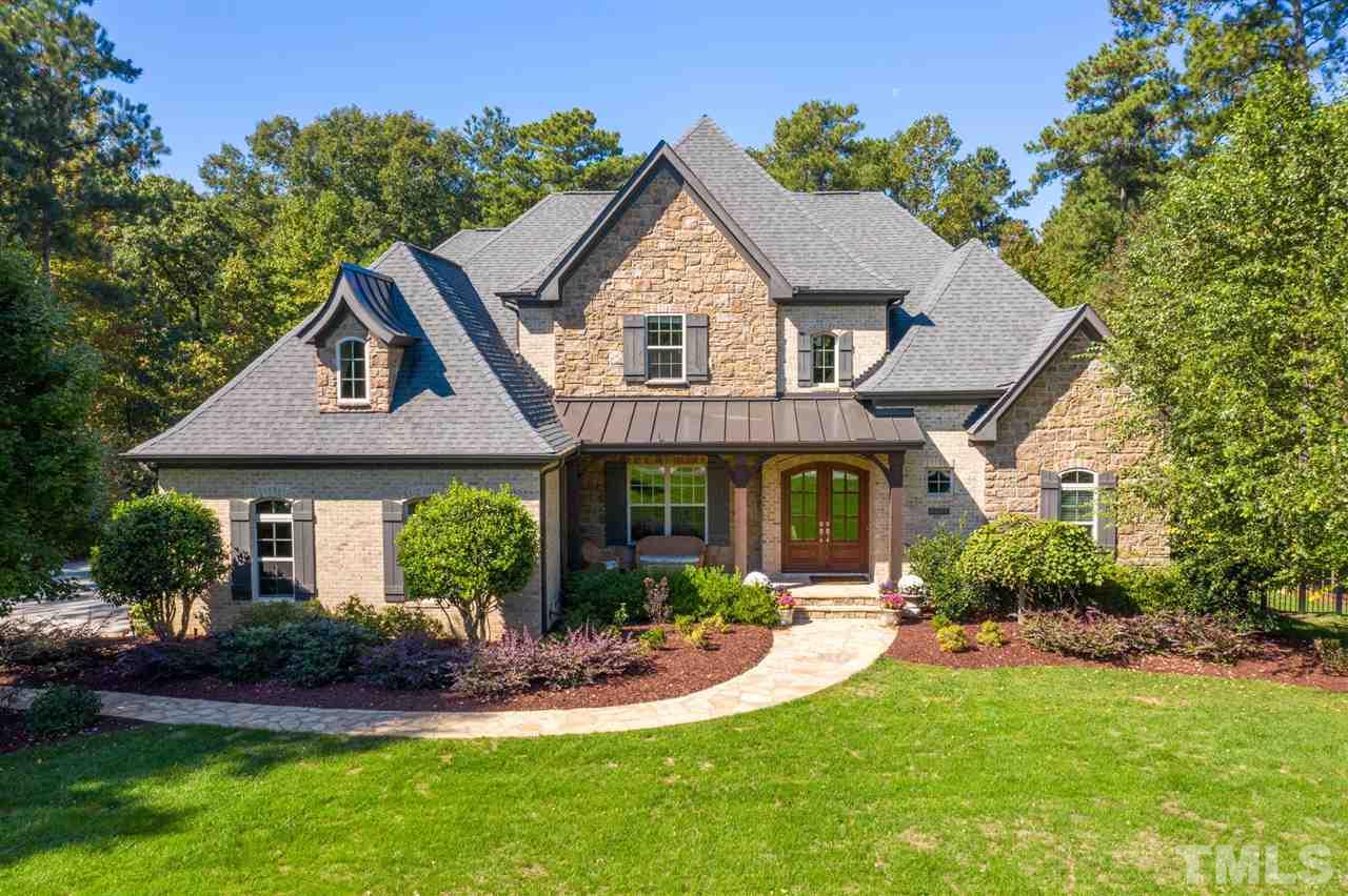 6037 Valencia Court Raleigh, NC 27614 - Photo 1 of 30 a front view of a house with a yard