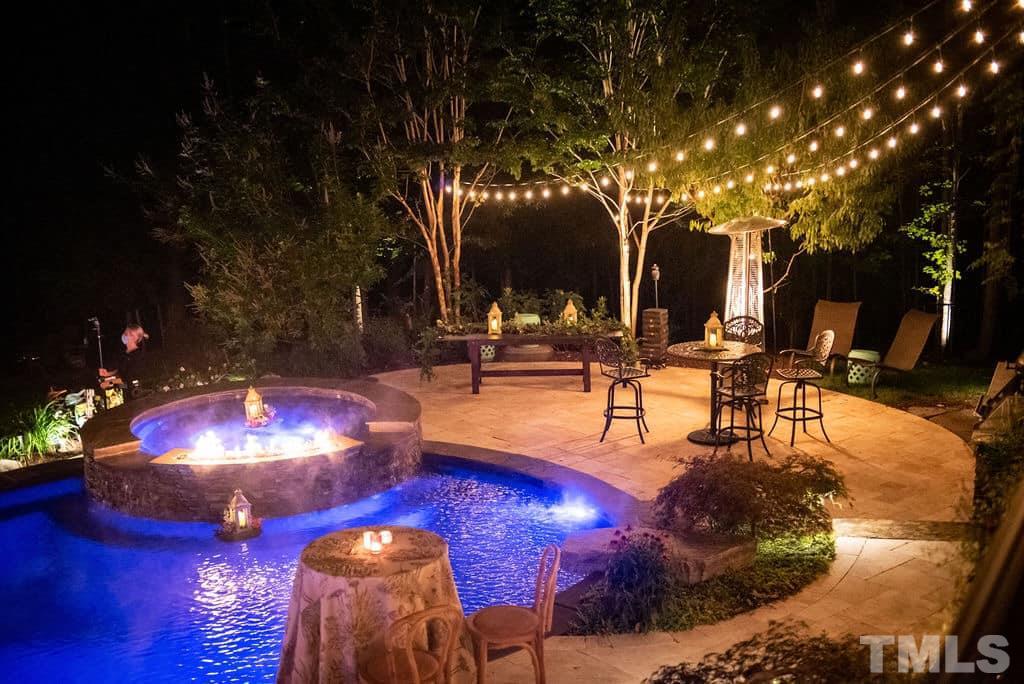6037 Valencia Court Raleigh, NC 27614 - Photo 2 of 30 a view of a swimming pool with an outdoor seating