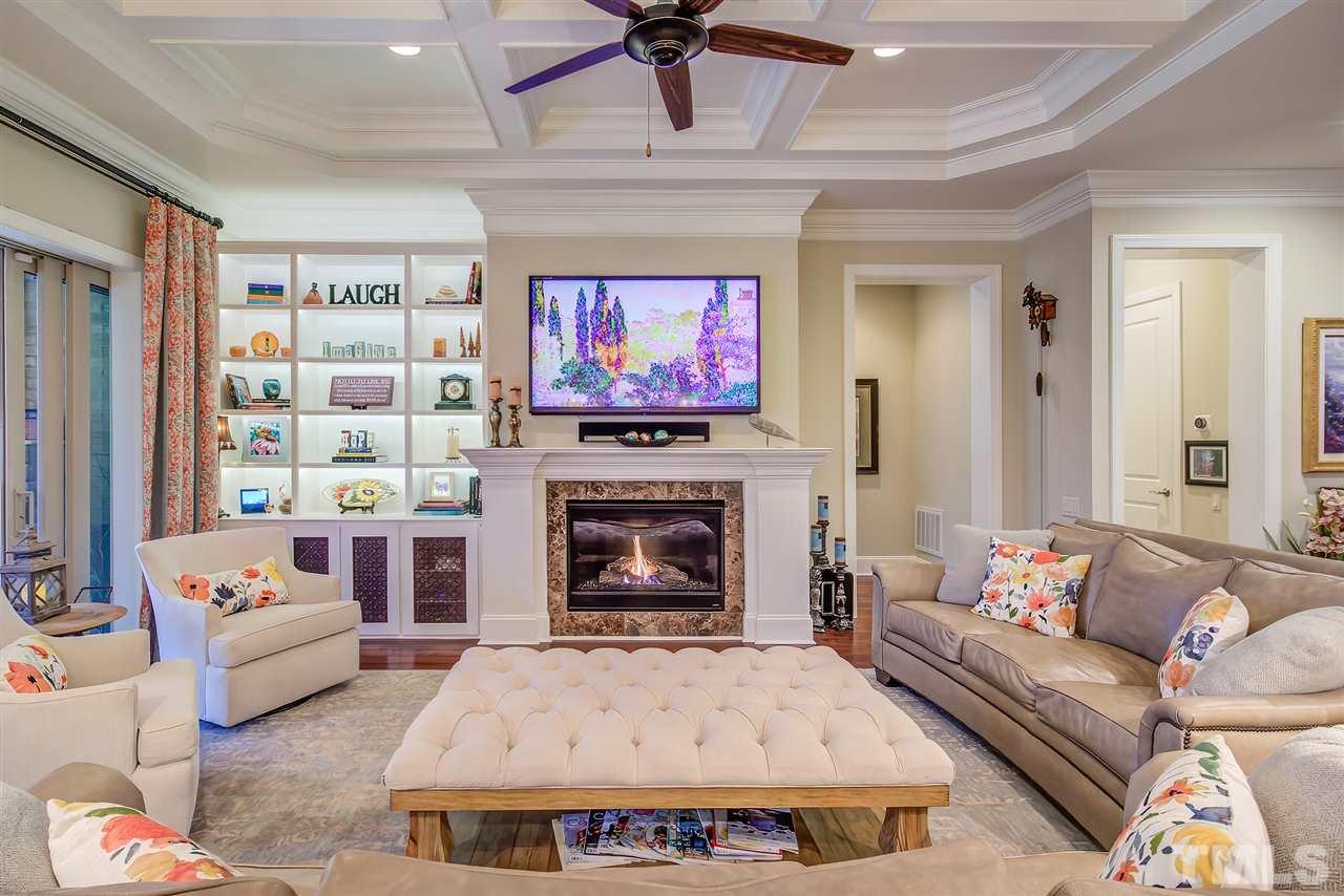 6037 Valencia Court Raleigh, NC 27614 - Photo 11 of 30 a living room with furniture and a fireplace