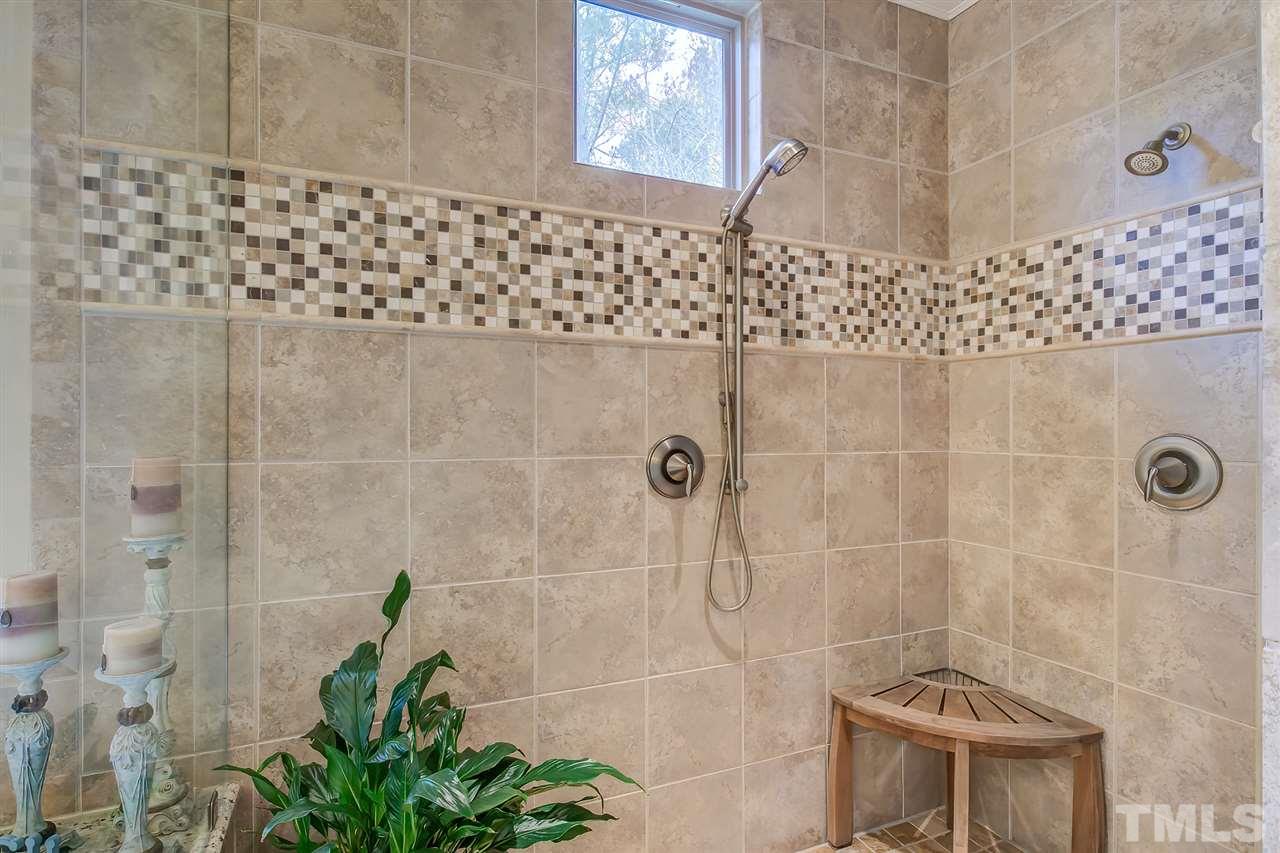 6037 Valencia Court Raleigh, NC 27614 - Photo 21 of 30 a bathroom with a shower