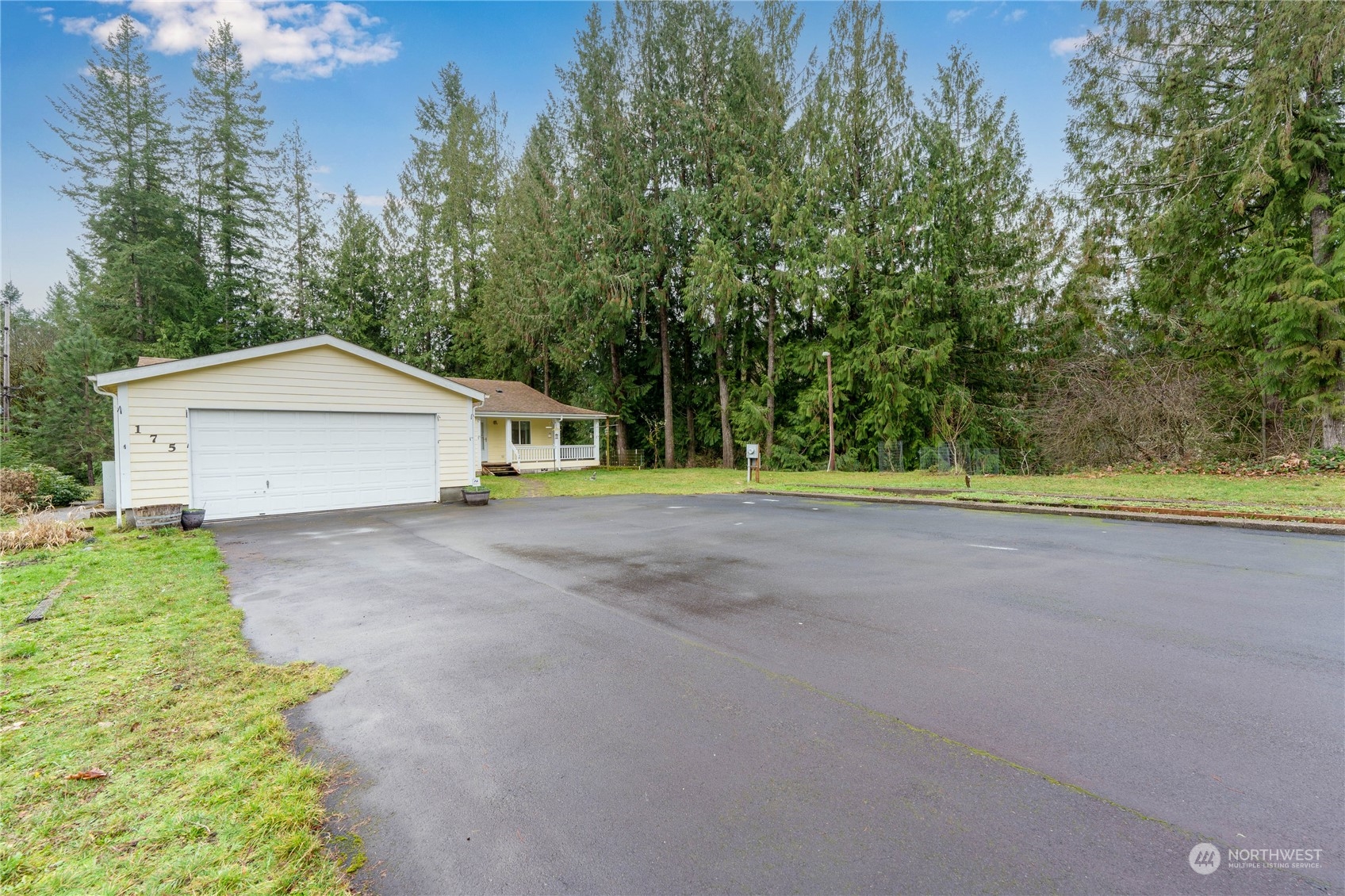 175 South Toutle Road Toutle, WA 98649 - Photo 3 of 29 a front view of a house with a yard and garage