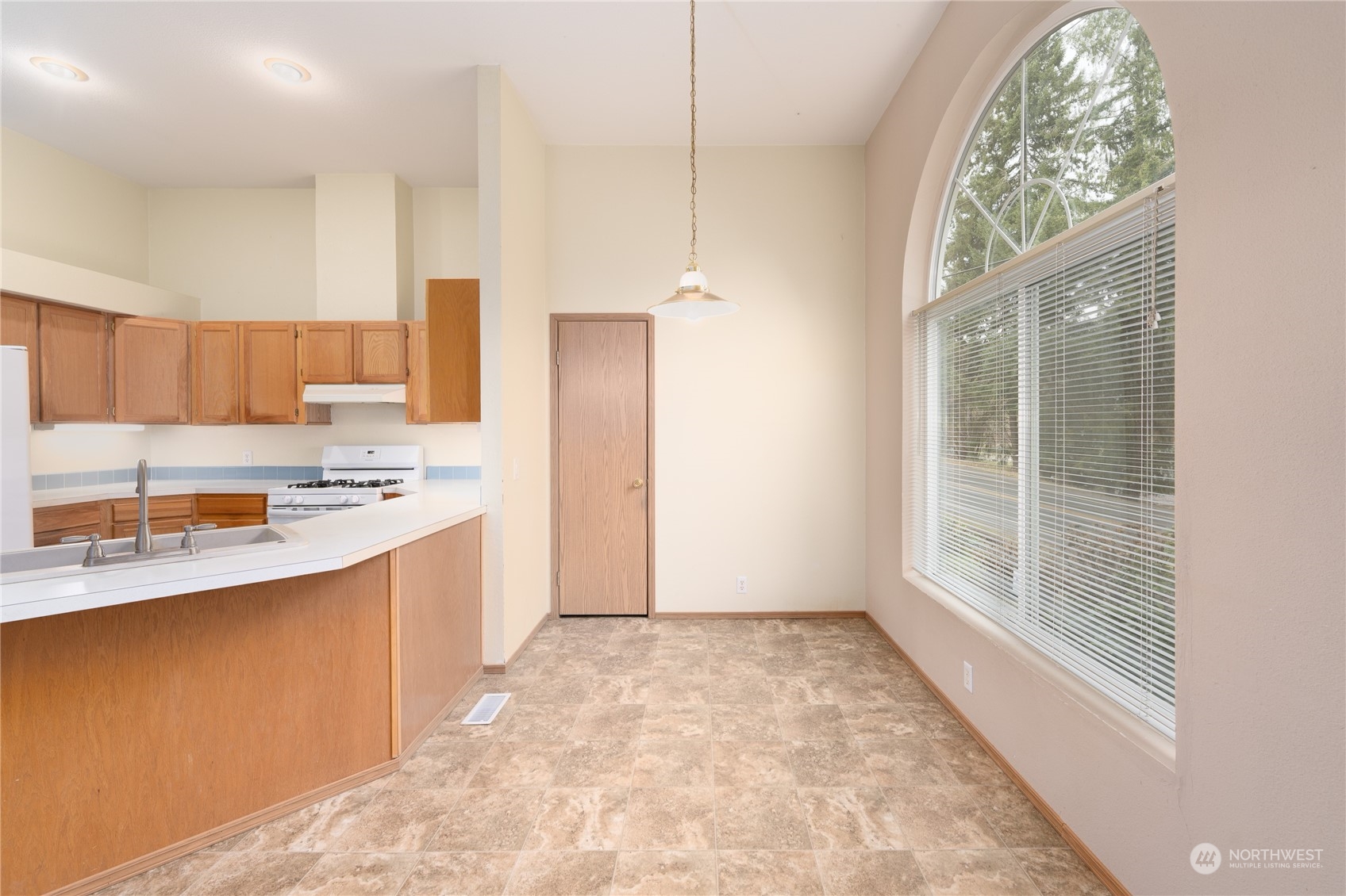 175 South Toutle Road Toutle, WA 98649 - Photo 10 of 29 a large kitchen with a large window appliances and cabinets