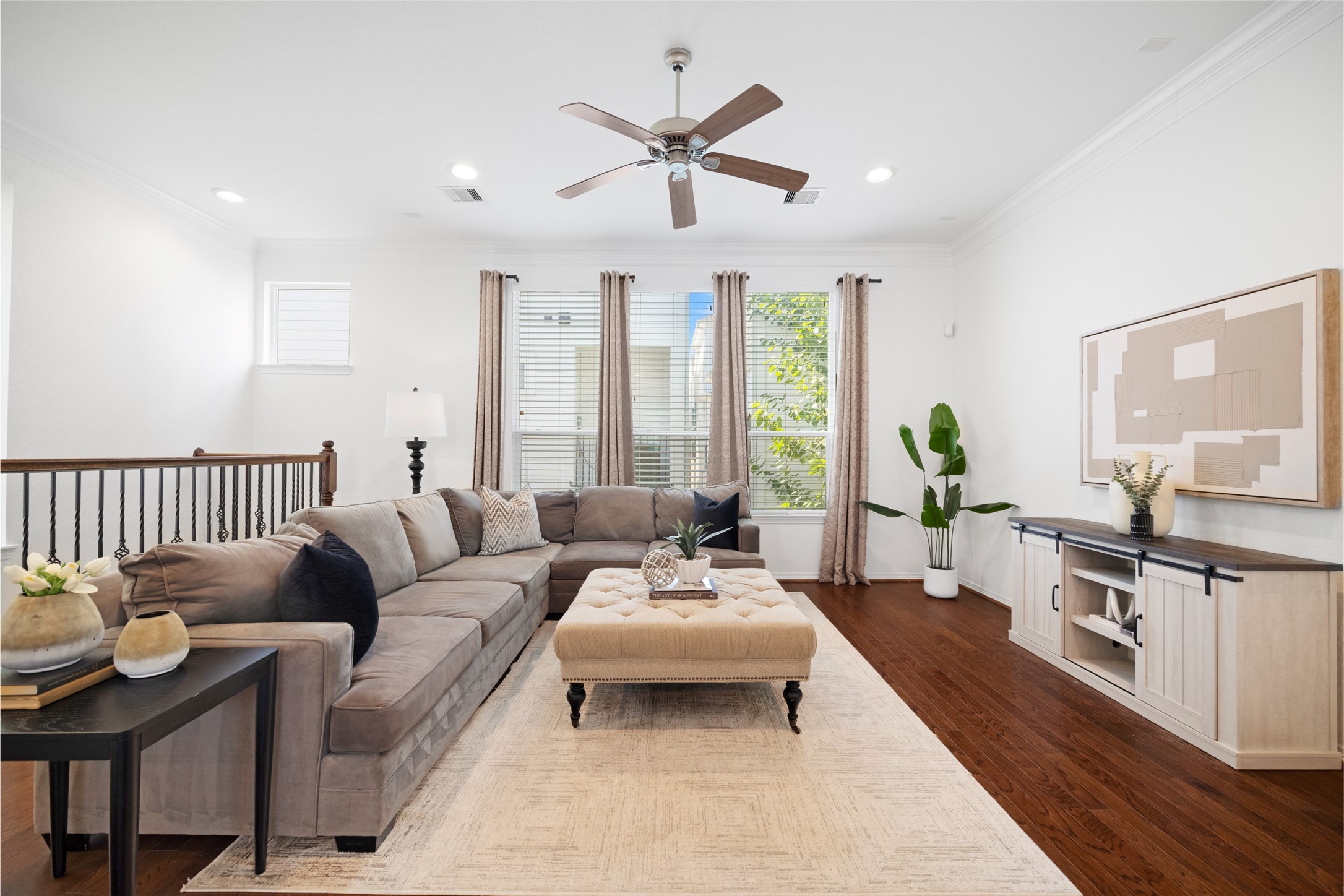 1172 West 17th Street Houston, TX 77008 - Photo 10 of 29 At the top of the stairs, you find your large main living space with tons of natural light and glowing hardwood floors.