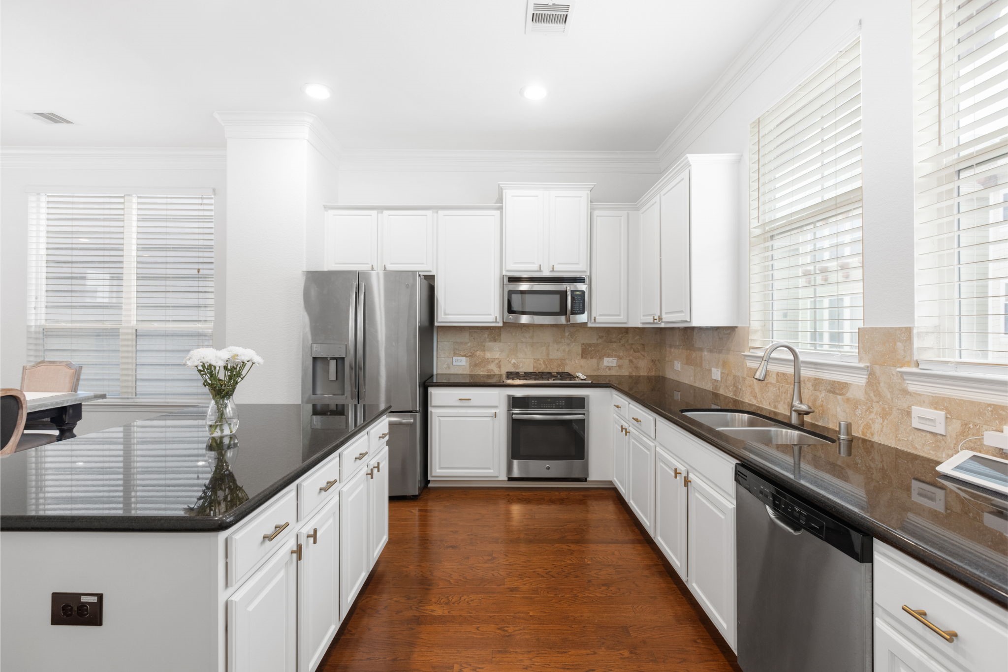 1172 West 17th Street Houston, TX 77008 - Photo 12 of 29 This kitchen has all the countertop space and storage you could need. The kitchen cabinets were repainted in 2024! Kitchen Refrigerator, Washer and Dryer stay with the home.