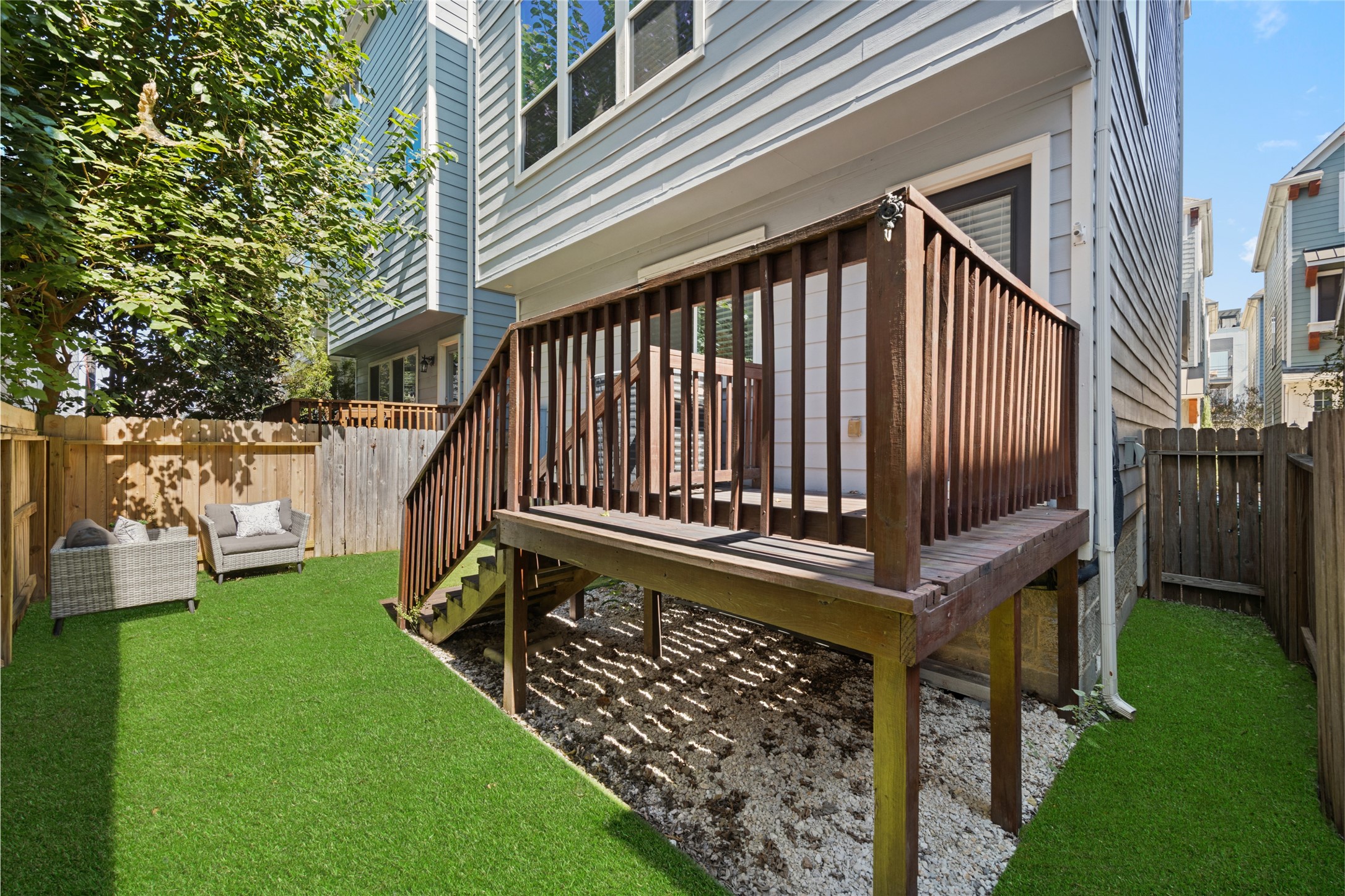1172 West 17th Street Houston, TX 77008 - Photo 5 of 29 Full turf backyard and a deck big enough for a grill with a small table and chairs. Installed in Aug of 2024.
