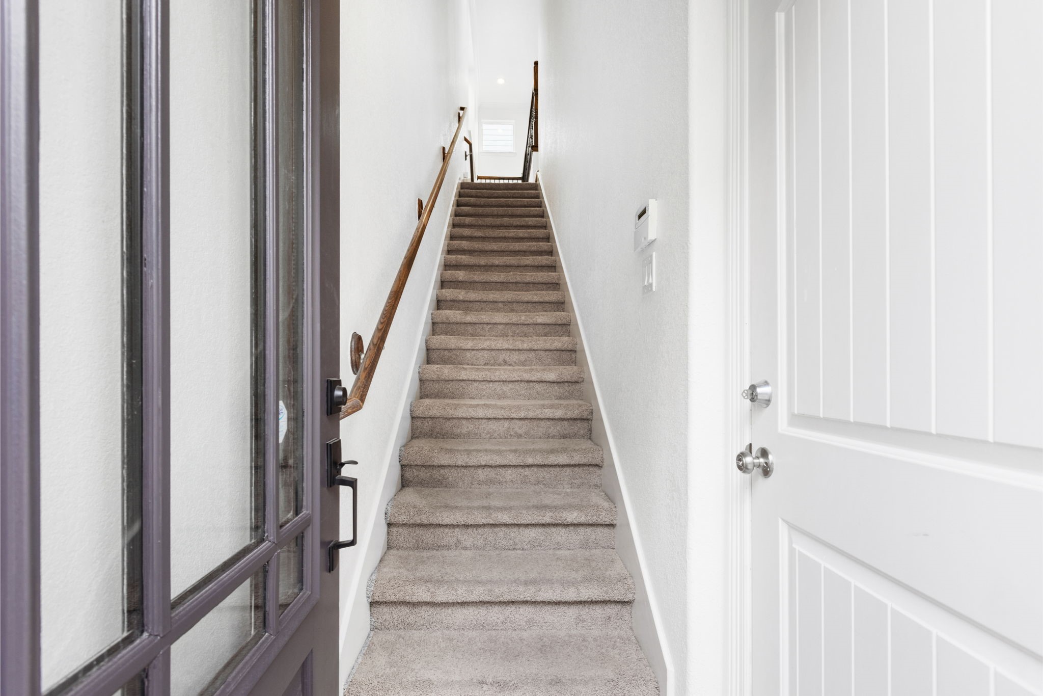 1172 West 17th Street Houston, TX 77008 - Photo 7 of 29 Upon entering you are greeted with a garage access point on your right, and the stairs to the main living room.