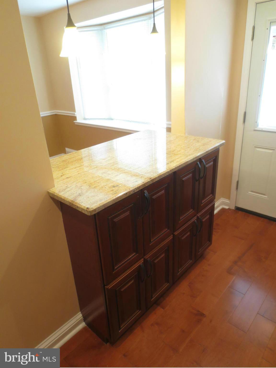 1405 Kitmore Road Baltimore, MD 21239 - Photo 6 of 25 a kitchen with a sink and a window
