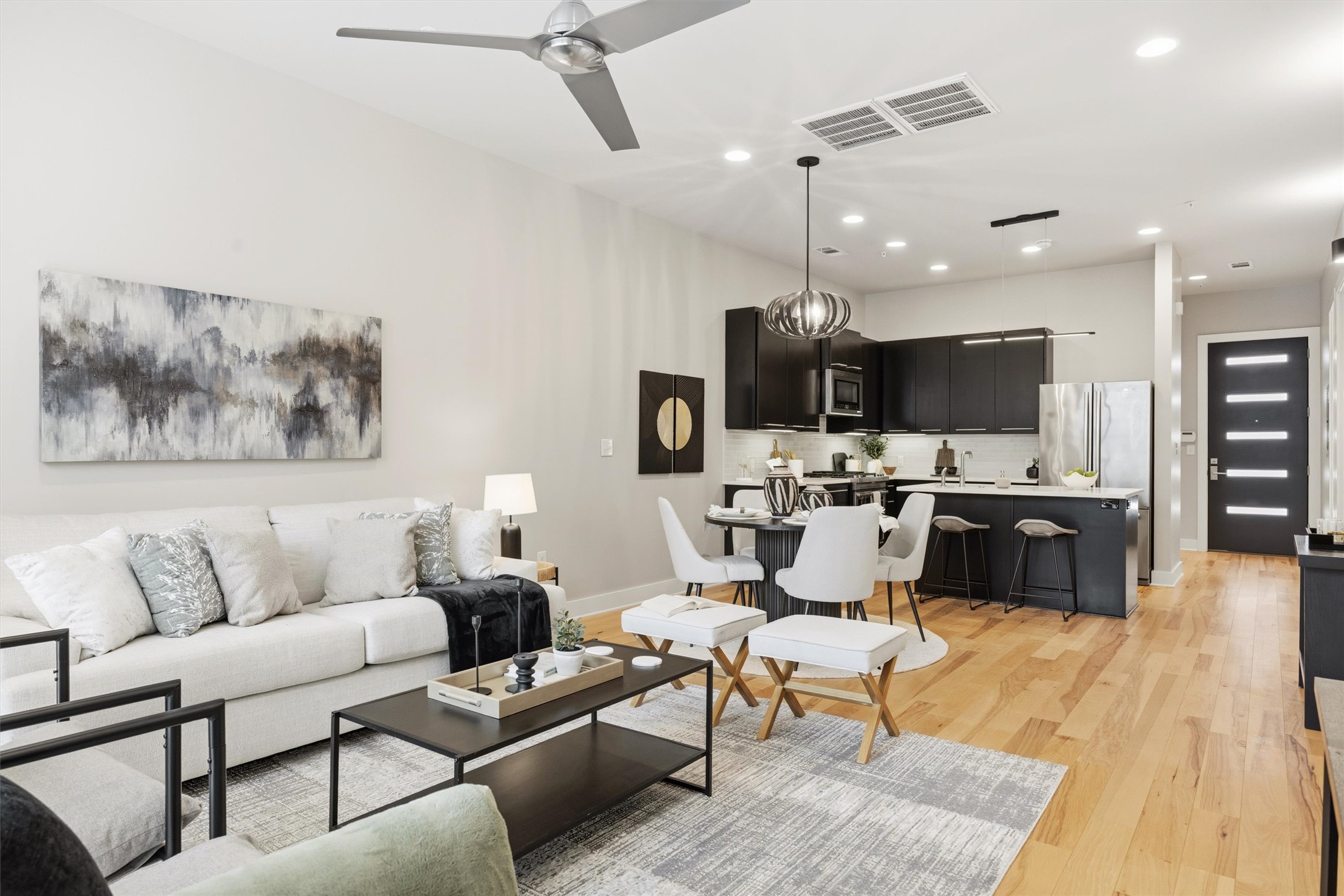 2314 Enfield Road, Unit 203 Austin, TX 78703 - Photo 1 of 37 The living and dining areas flow together seamlessly — an ideal layout for modern living.