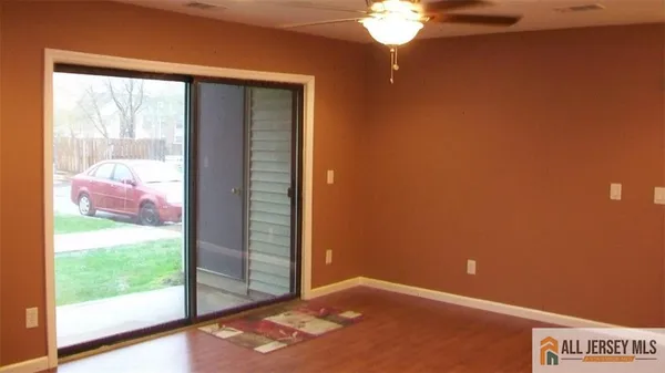 a view of a room with a large window