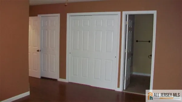 an empty room with wooden floor