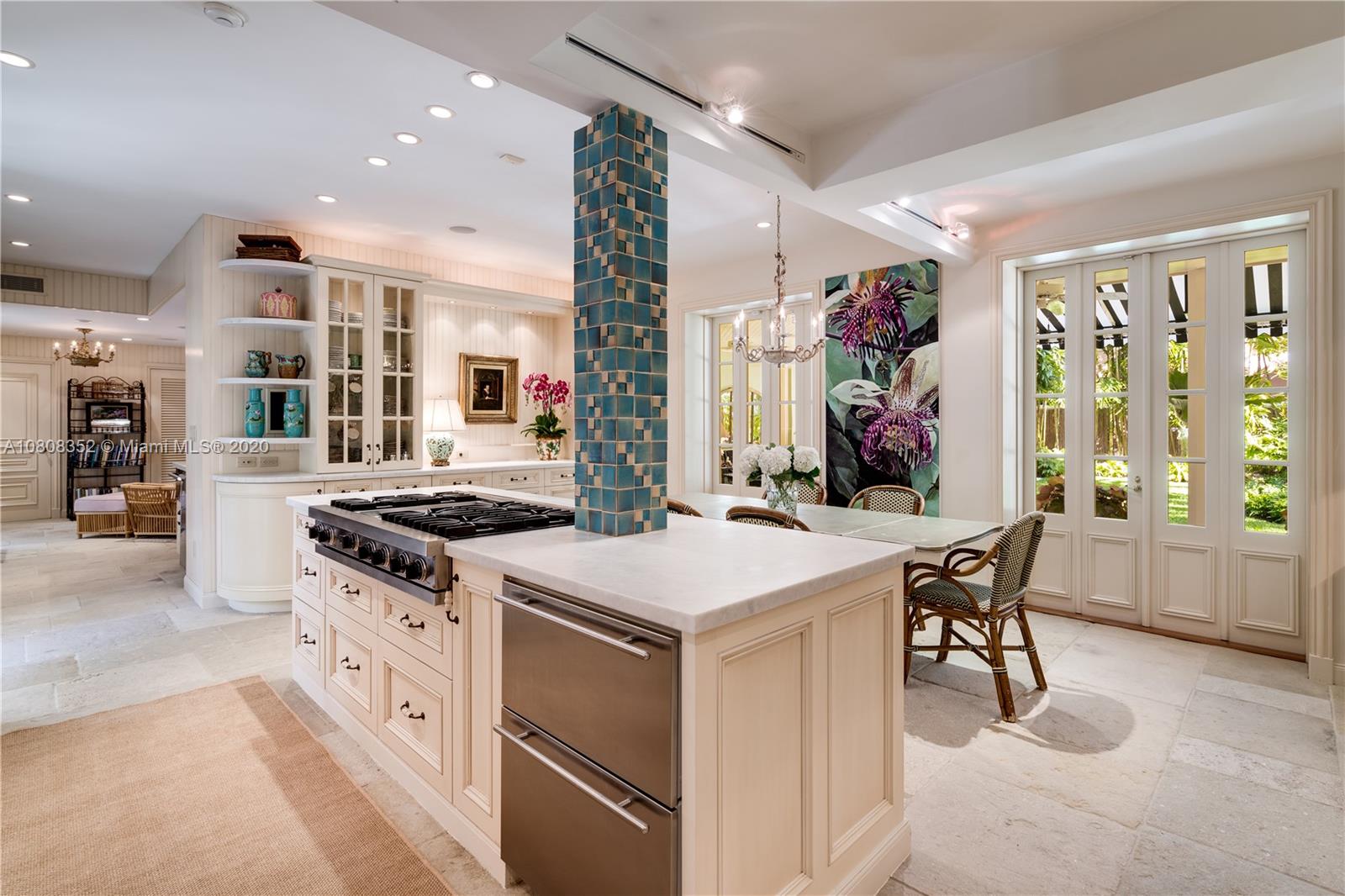 1030 Hardee Road Coral Gables, FL 33146 - Photo 13 of 55 a kitchen with stainless steel appliances granite countertop a stove and a refrigerator