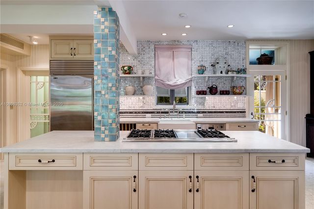 a shelf with books and knick knacks on it