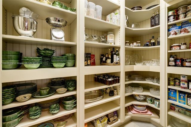 a bathroom with a sink mirror and vanity