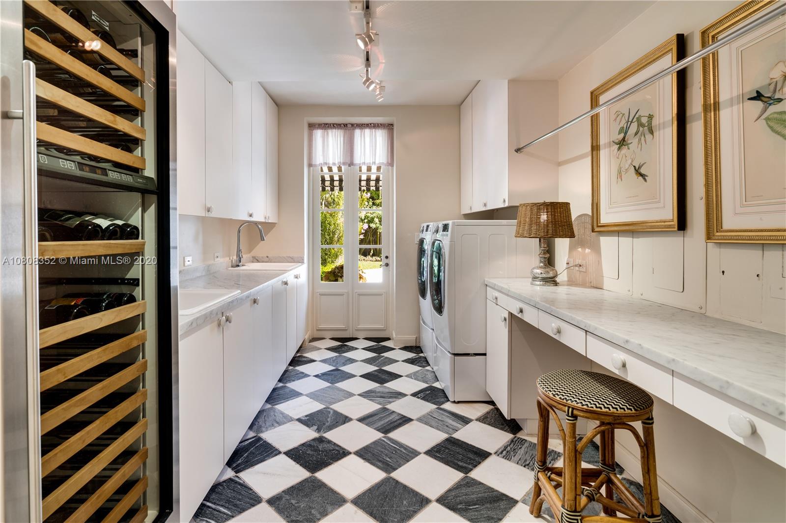1030 Hardee Road Coral Gables, FL 33146 - Photo 17 of 55 a kitchen with a sink a refrigerator and cabinets