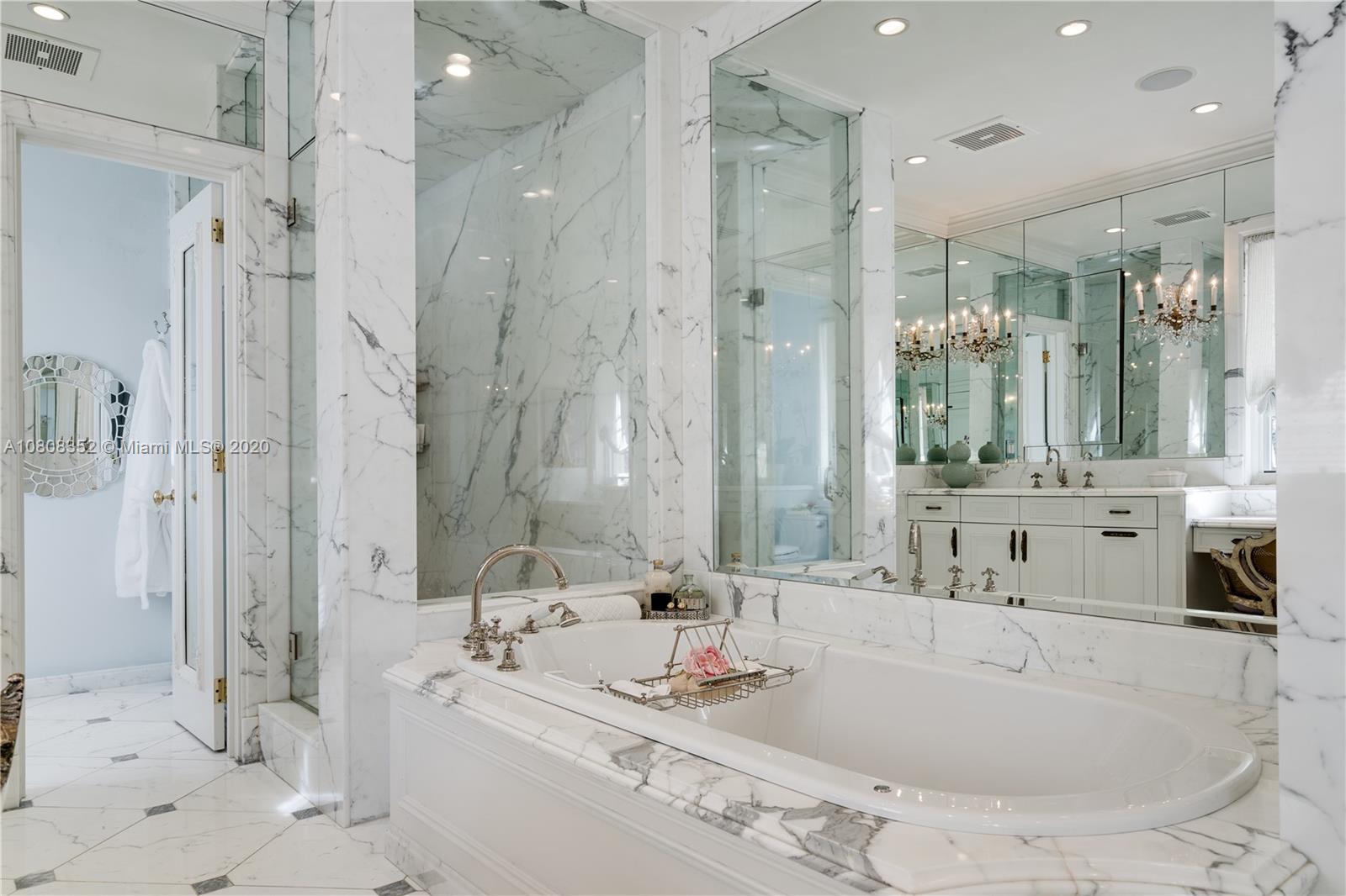 1030 Hardee Road Coral Gables, FL 33146 - Photo 23 of 55 a bathroom with double vanity sinks and a large mirror