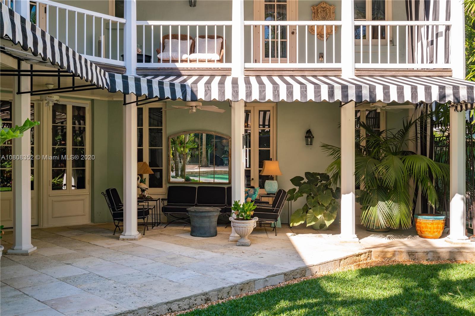 1030 Hardee Road Coral Gables, FL 33146 - Photo 36 of 55 a front view of a building with a garden and sitting area