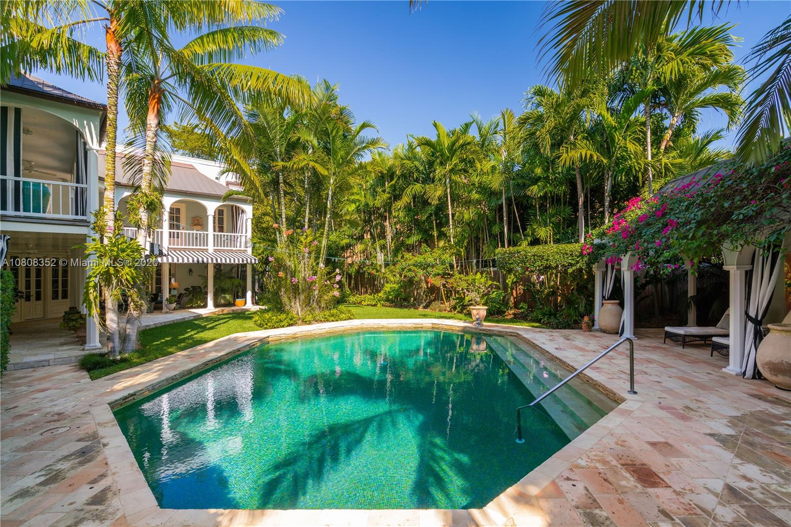 1030 Hardee Road Coral Gables, FL 33146 - Photo 38 of 55 a backyard of a house with table and chairs