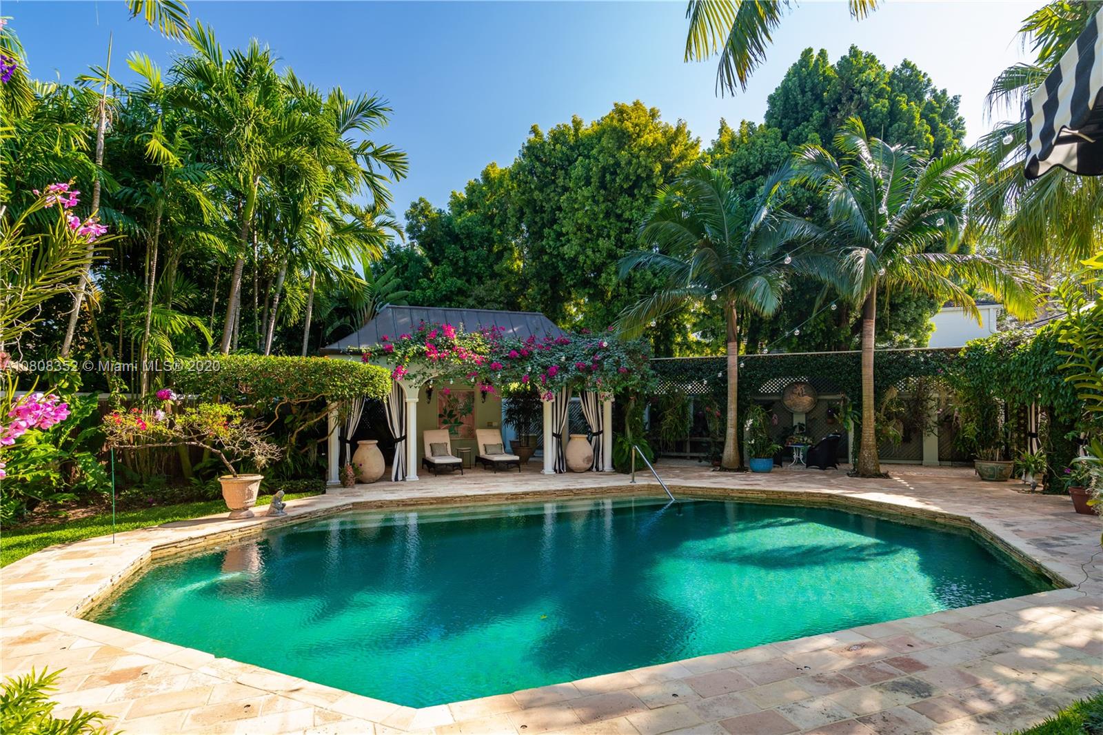 1030 Hardee Road Coral Gables, FL 33146 - Photo 40 of 55 a view of a swimming pool with an outdoor seating