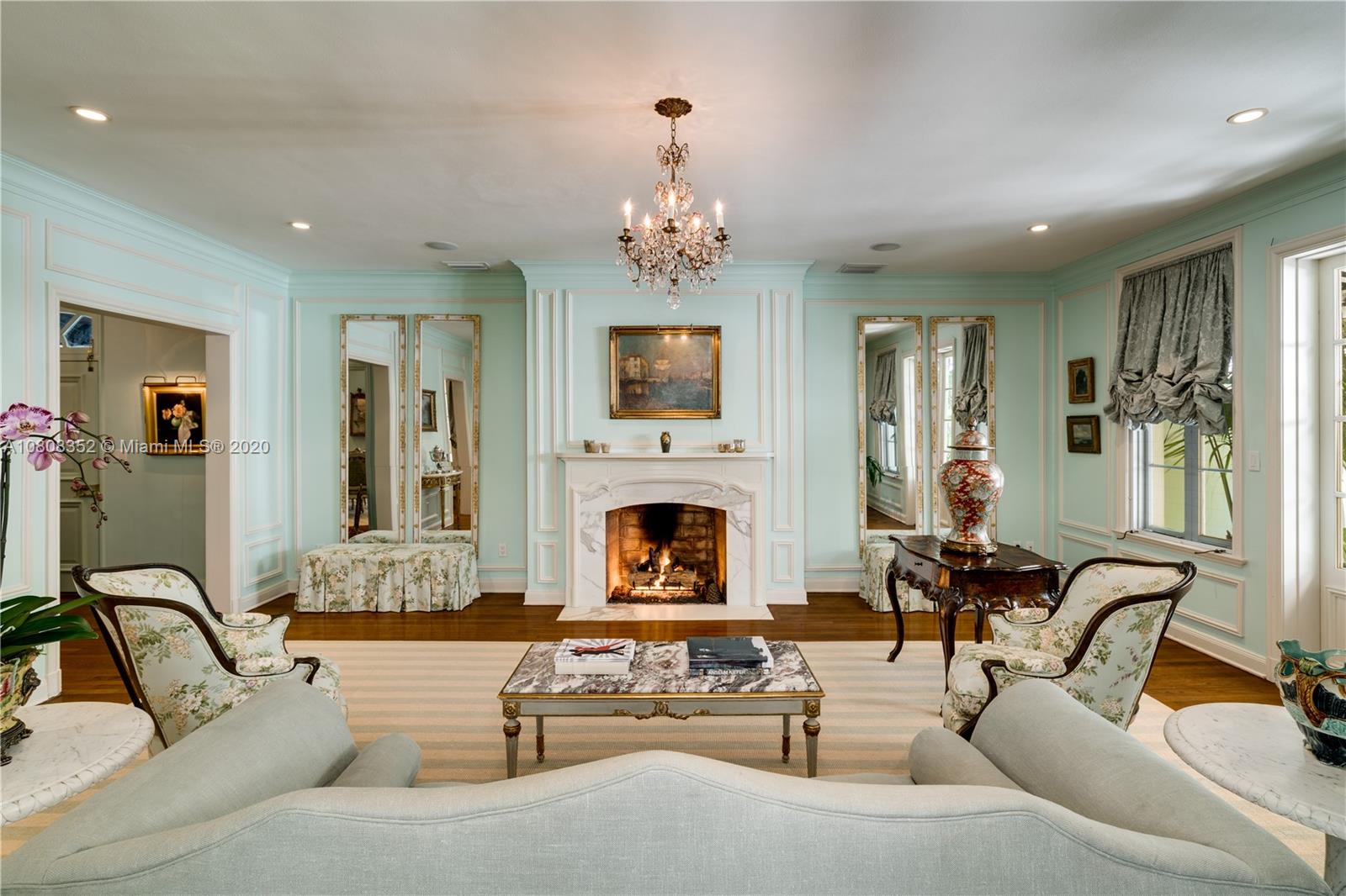 1030 Hardee Road Coral Gables, FL 33146 - Photo 4 of 55 a living room with furniture chandelier and fireplace