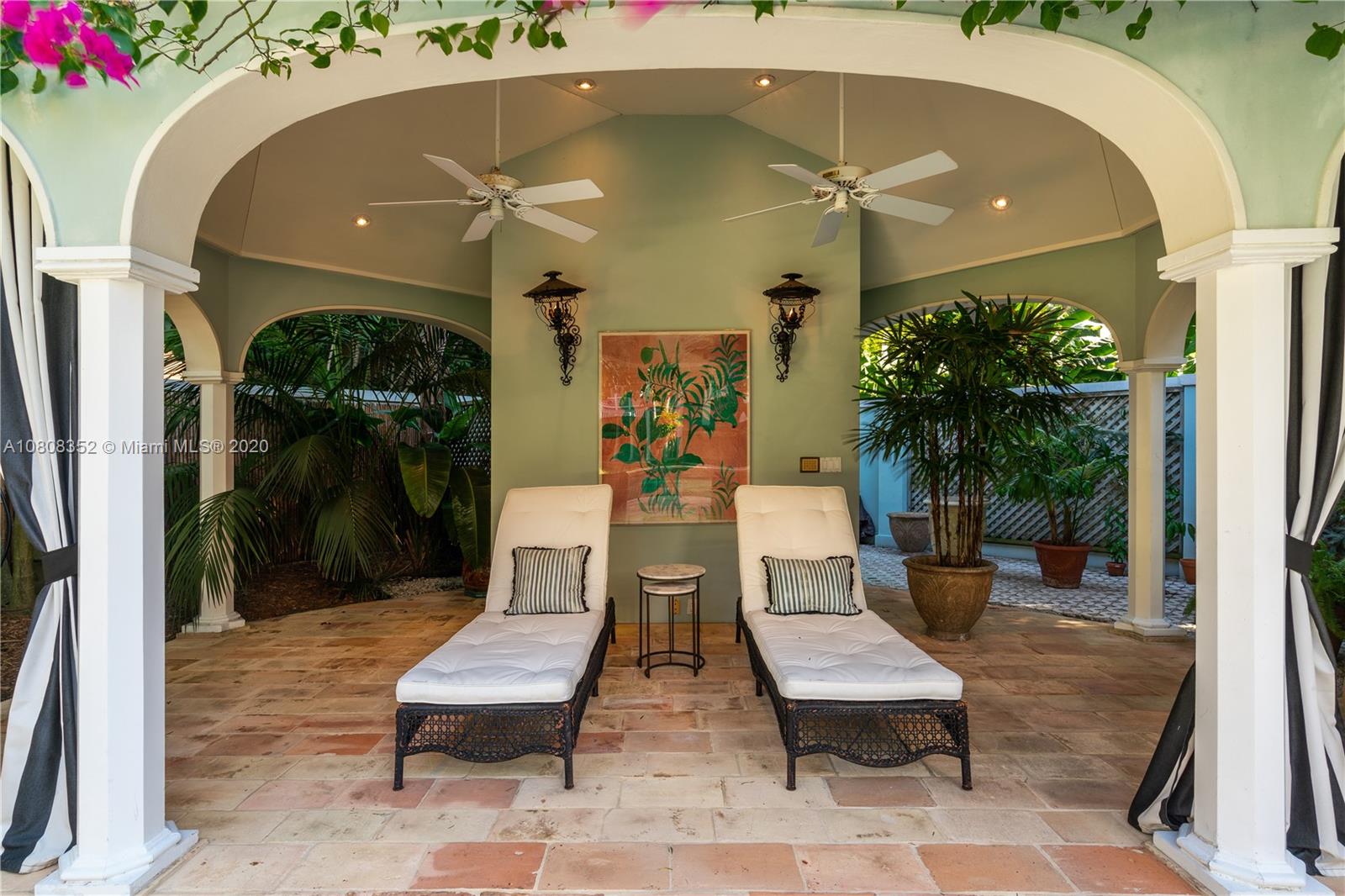 1030 Hardee Road Coral Gables, FL 33146 - Photo 41 of 55 a view of a patio with table and chairs potted plants