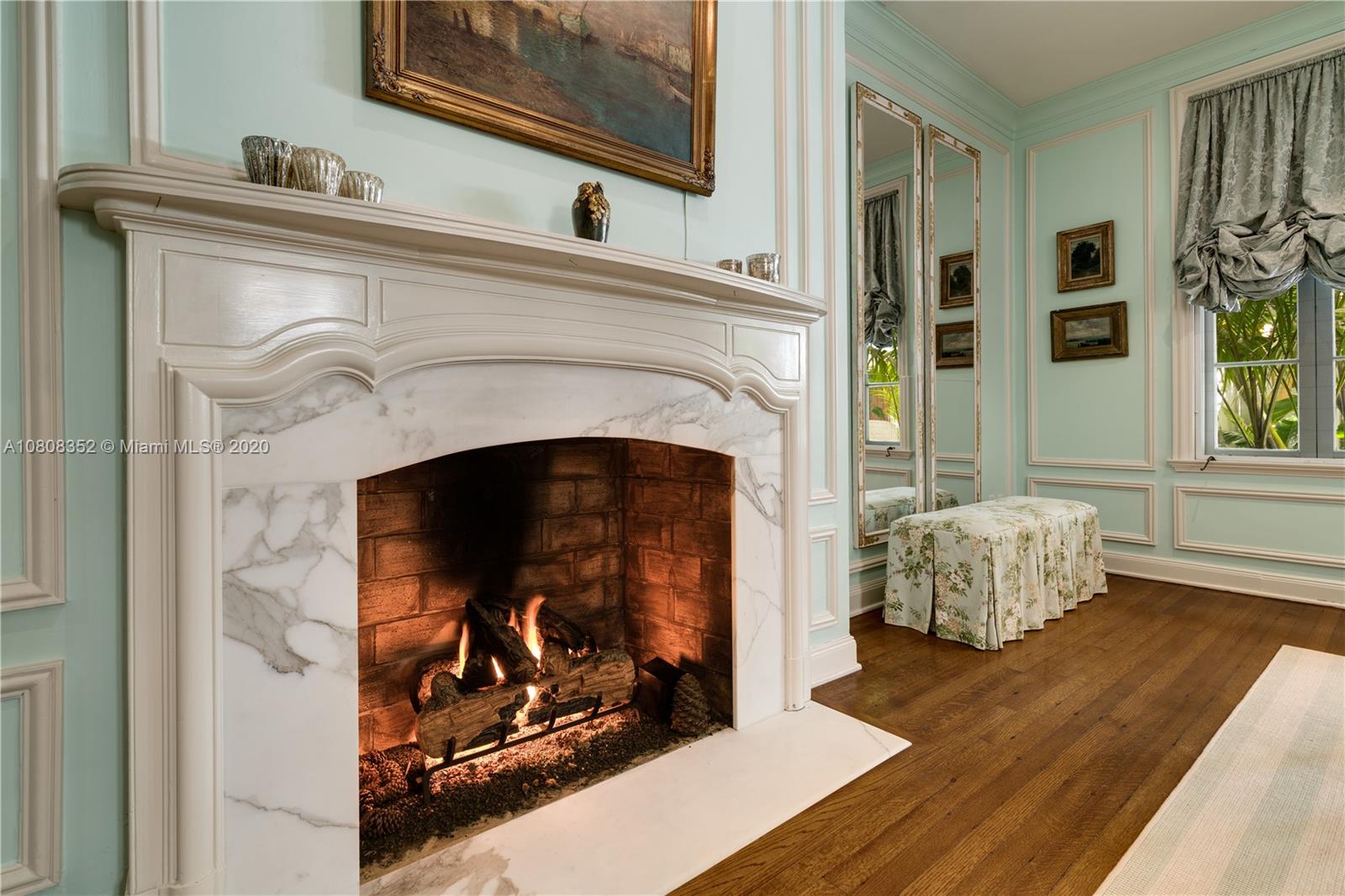 1030 Hardee Road Coral Gables, FL 33146 - Photo 6 of 55 a living room with a fireplace with wooden floor