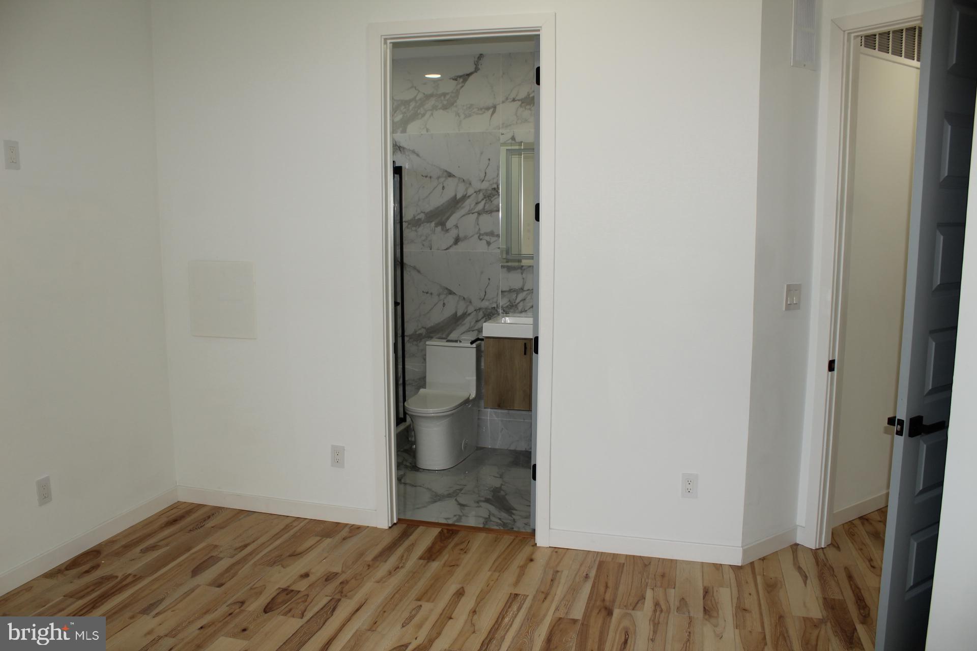 3017 Ridge Avenue, Unit B Philadelphia, PA 19121 - Photo 25 of 29 Modern bathroom entrance in serene space.