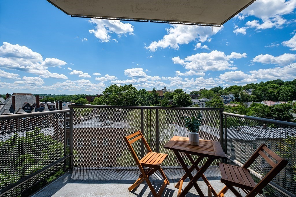 19 Winchester Street, Unit 801 Brookline, MA 02446 - Photo 12 of 19 a view of a balcony with two chairs and a table