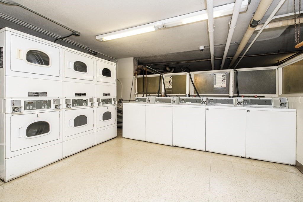 19 Winchester Street, Unit 801 Brookline, MA 02446 - Photo 15 of 19 a utility room with dryer and washer