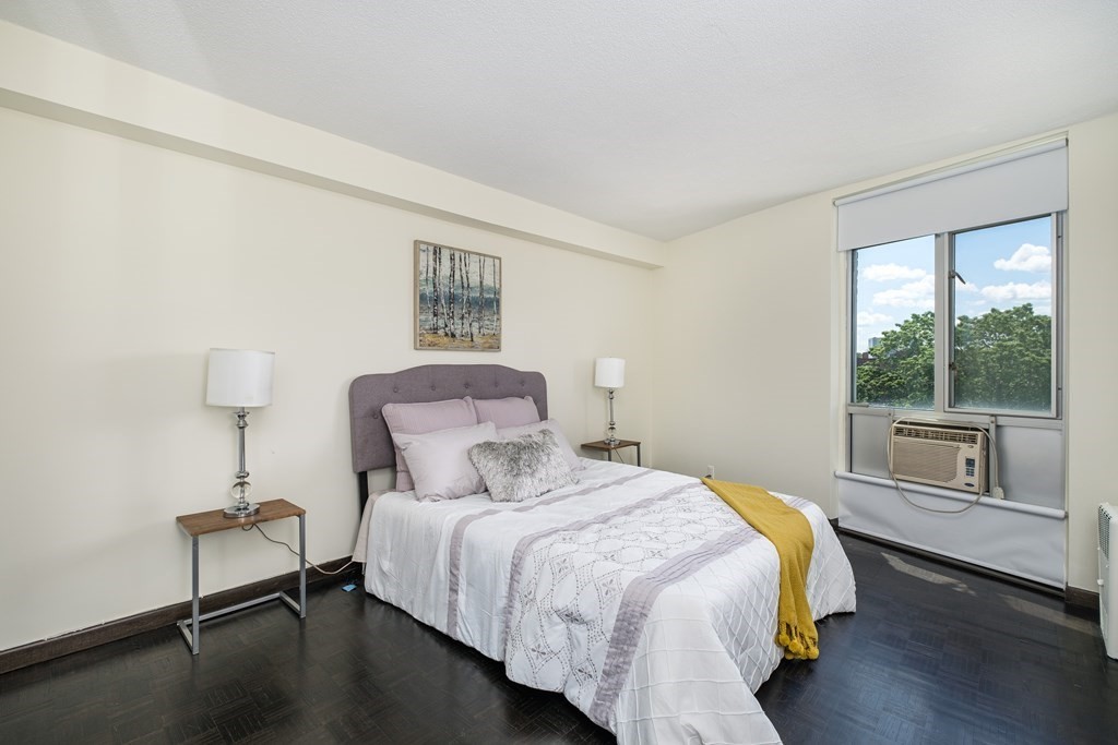 19 Winchester Street, Unit 801 Brookline, MA 02446 - Photo 9 of 19 a bedroom with a bed and a window
