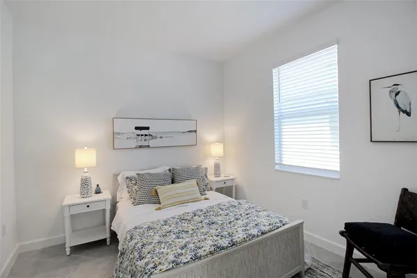 a bedroom with a rug and a bed