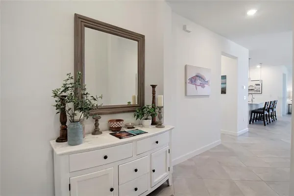 a living room with furniture dining table and a window