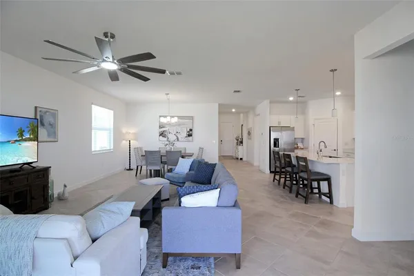 a kitchen with stainless steel appliances granite countertop a sink and white cabinets