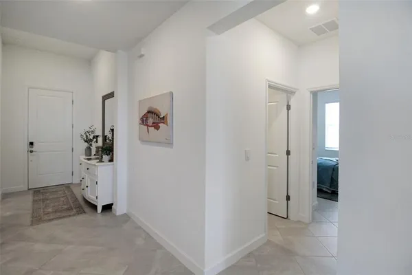 a bedroom with a bed and lamp