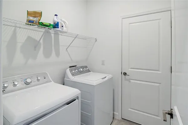 a bathroom with a shower and a sink
