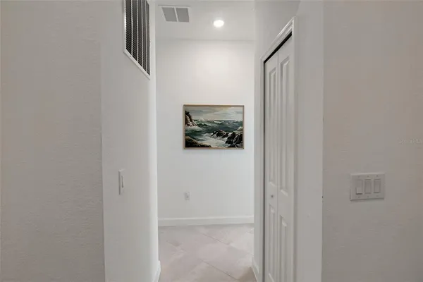 a bedroom with bed and a couch