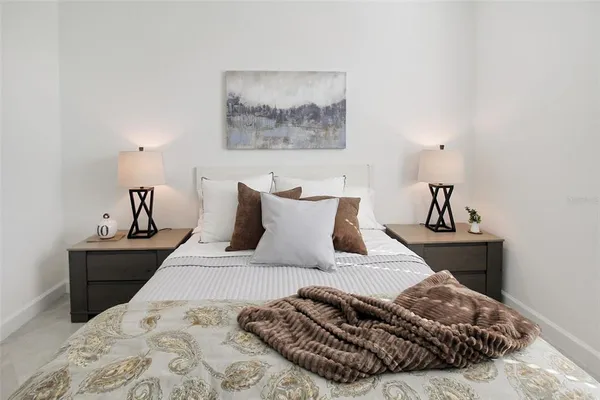 a bedroom with a bed and couch