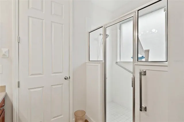 a view of a bathroom with mirror