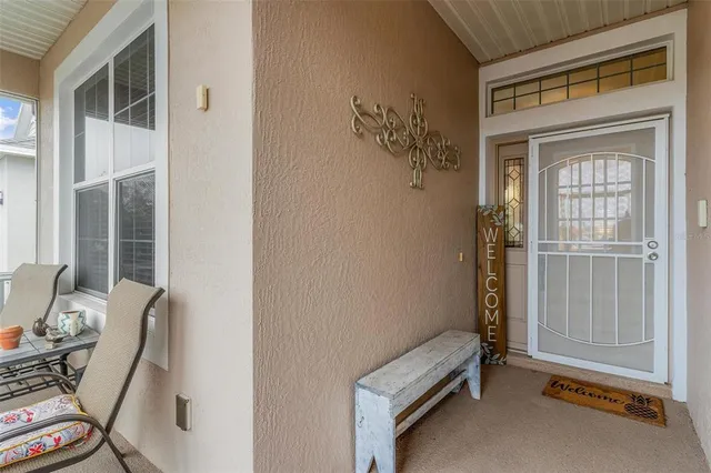 a view of room with furniture and windows