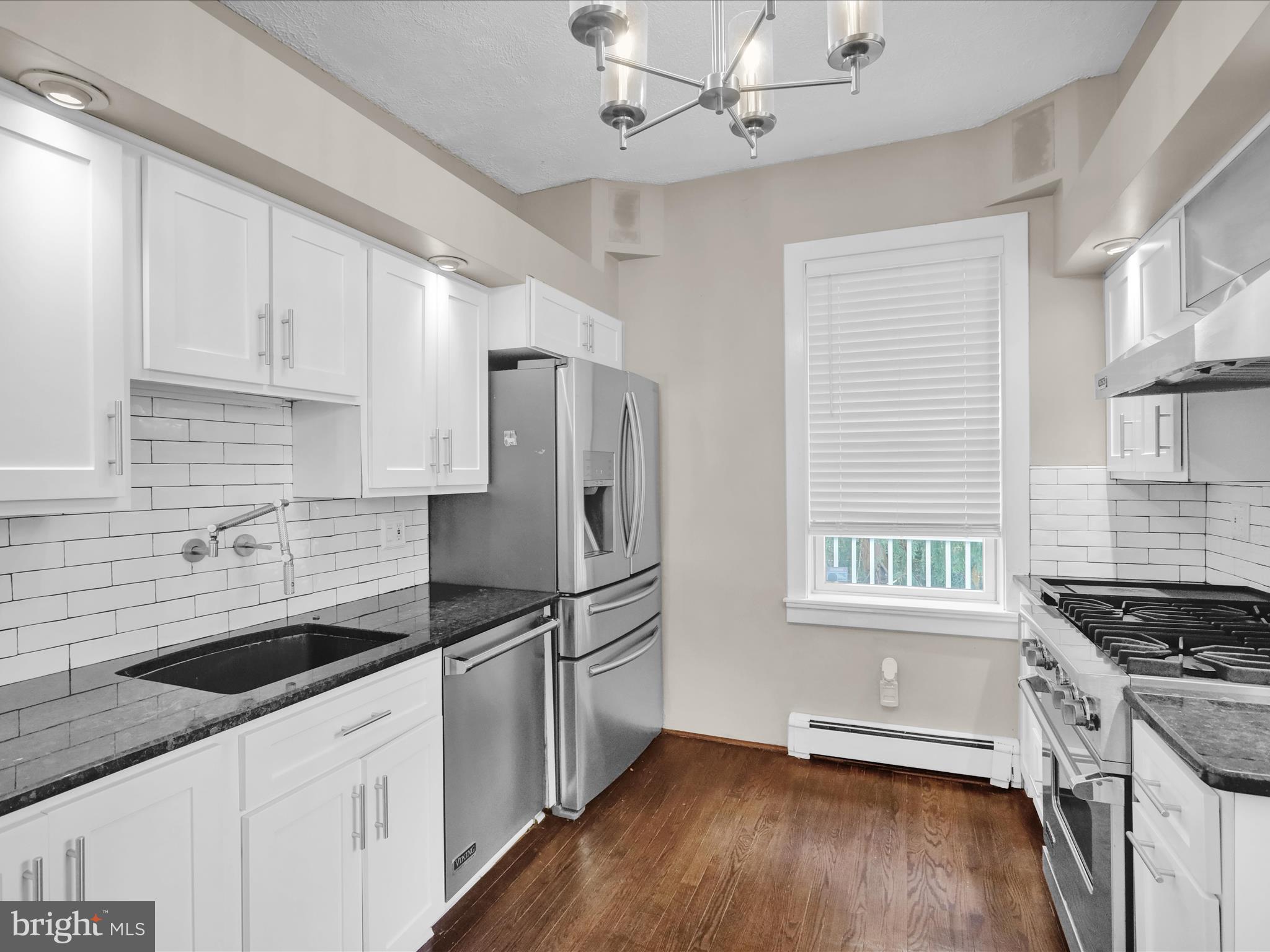 1315 Cleveland Avenue Wyomissing, PA 19610 - Photo 11 of 43 a kitchen with granite countertop a sink appliances cabinets and counter space